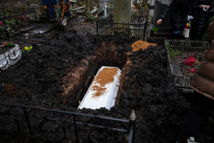 Grieving,Relatives,Bury,The,White,Coffin,In,The,Pit,,Throwing