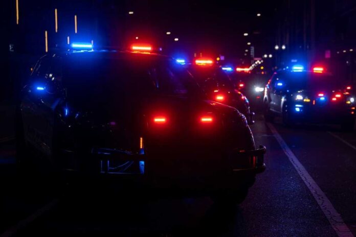 Multiple,Police,Cars,In,The,Roadway,With,Their,Lights,On