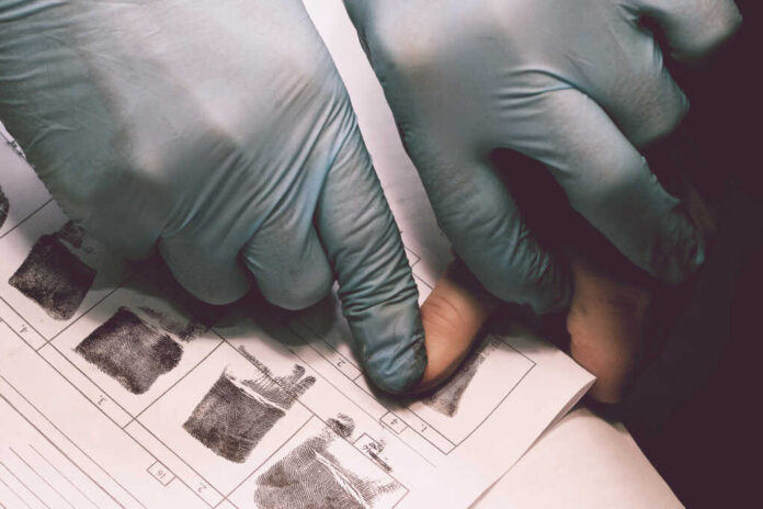 The,Investigator,Takes,Fingerprints,From,The,Suspect,In,The,Crime.