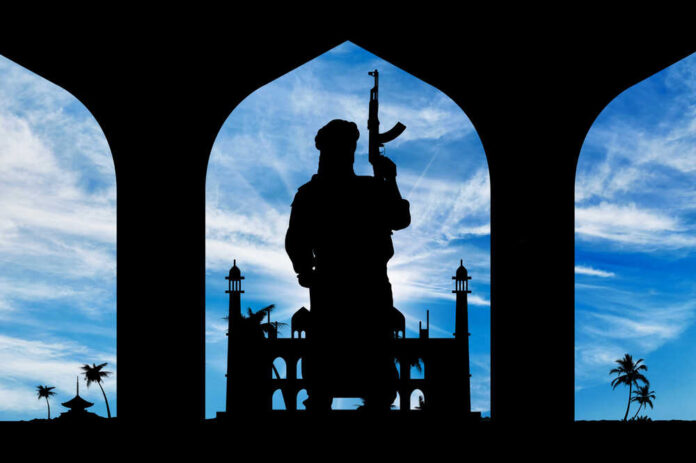 Concept,Of,Terrorism.,Silhouette,Of,A,Terrorist,With,A,Weapon