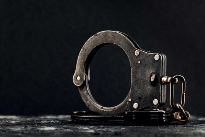 Handcuffs,On,A,Dark,Background.,The,Concept,Of,Crime,And