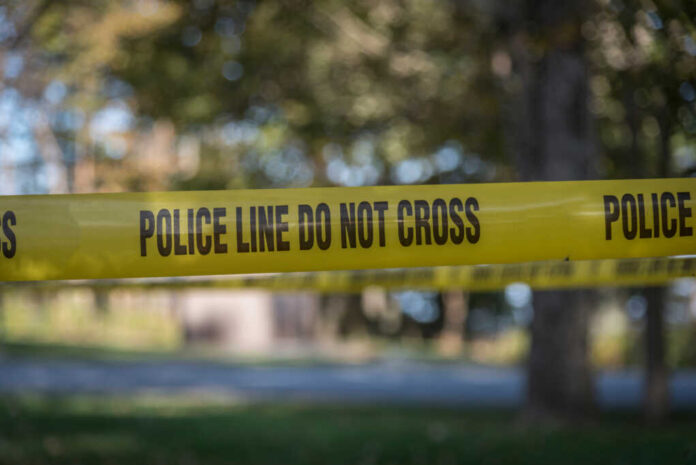 Police,Line,Tape,At,The,Scene,Of,A,Crime.